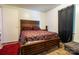 Inviting bedroom featuring a wooden bed frame, patterned bedding, and wood flooring at 517 Fieldcrest Dr, Chester, SC 29706