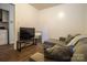 Comfortable living space featuring a sectional sofa, TV, and convenient laundry area access at 517 Fieldcrest Dr, Chester, SC 29706