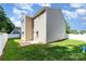 Spacious backyard with well-kept lawn, a concrete patio, and privacy fence, ideal for outdoor activities and relaxation at 523 Smokehouse Ln, Albemarle, NC 28001
