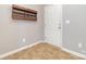 Neutral entryway features tile floor, coat hooks, and a white front door at 523 Smokehouse Ln, Albemarle, NC 28001