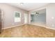 Eat in kitchen with tile flooring, access to the living room, stainless steel appliances and a backdoor at 523 Smokehouse Ln, Albemarle, NC 28001