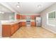 Kitchen featuring wooden cabinets, stainless steel appliances, tile flooring, and recessed lighting at 523 Smokehouse Ln, Albemarle, NC 28001