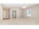 Bright, open living room with neutral carpet, gray walls, lots of natural light and recessed lighting at 523 Smokehouse Ln, Albemarle, NC 28001