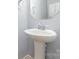 Powder room features a pedestal sink, sleek faucet, and mirrored medicine cabinet at 523 Smokehouse Ln, Albemarle, NC 28001