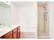 Bathroom featuring double sinks, a shower, and a soaking tub at 5319 Swearngan Rd, Charlotte, NC 28216