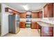Well-equipped kitchen with stainless steel appliances, dark cabinetry, and ample counter space at 5319 Swearngan Rd, Charlotte, NC 28216