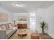 Comfortable living room featuring stylish decor, wood-look flooring, and a view of the outdoor space at 5319 Swearngan Rd, Charlotte, NC 28216