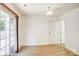 Bright and airy living room with wood-look flooring, leading to a patio door for easy outdoor access at 5319 Swearngan Rd, Charlotte, NC 28216