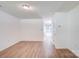 Spacious living room with sleek flooring, access to a back patio, and neutral walls for versatile decorating at 5319 Swearngan Rd, Charlotte, NC 28216
