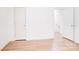 Bright room featuring wood-look flooring and neutral walls at 5319 Swearngan Rd, Charlotte, NC 28216