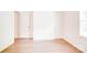 Bright room showcasing wood-look flooring and two doors at 5319 Swearngan Rd, Charlotte, NC 28216