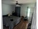 Cozy bedroom with wood-look floors and a dark ceiling fan at 5324 Weblee Ct, Kings Mountain, NC 28086