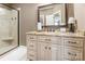 Well-lit bathroom features granite countertops, vanity, and glass-enclosed shower at 572 W Shiloh Unity Rd, Lancaster, SC 29720
