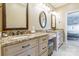 Dual vanities with granite countertops and framed mirrors enhance this luxurious bathroom at 572 W Shiloh Unity Rd, Lancaster, SC 29720