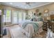 Comfortable bedroom with french doors, ample natural light, and decor at 572 W Shiloh Unity Rd, Lancaster, SC 29720