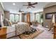 Spacious bedroom with large windows, comfortable bed, desk, and sitting area at 572 W Shiloh Unity Rd, Lancaster, SC 29720