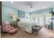 Stylish bedroom featuring calming blue walls, comfortable seating and ample natural light at 572 W Shiloh Unity Rd, Lancaster, SC 29720