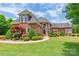 Stately brick home boasting manicured landscaping and classic architectural details at 572 W Shiloh Unity Rd, Lancaster, SC 29720