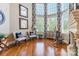 Sunlit living room featuring hardwood floors, fireplace, and comfortable seating at 572 W Shiloh Unity Rd, Lancaster, SC 29720