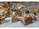 Rustic living room with wood paneled walls and ceiling, filled with taxidermy and comfortable seating at 572 W Shiloh Unity Rd, Lancaster, SC 29720