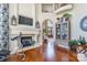 Living room with a fireplace, hardwood floors, and comfortable seating at 572 W Shiloh Unity Rd, Lancaster, SC 29720