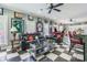 Spacious living room with sports decor, checkered floors, and modern furnishings adjacent to the kitchen at 572 W Shiloh Unity Rd, Lancaster, SC 29720