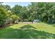 Enjoy the spacious backyard featuring a deck and storage building, perfect for outdoor activities and storage at 5914 Mt Holly Huntersville Rd, Charlotte, NC 28216