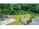 An aerial view captures a deck and patio in the expansive green backyard, creating an ideal outdoor retreat at 5914 Mt Holly Huntersville Rd, Charlotte, NC 28216