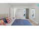 Cozy bedroom showcasing a comfortable bed, closet, and access to the bathroom at 5914 Mt Holly Huntersville Rd, Charlotte, NC 28216