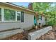 Charming brick home featuring black shutters and a vibrant turquoise door for a modern touch at 5914 Mt Holly Huntersville Rd, Charlotte, NC 28216
