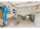 Spacious garage with exposed ceiling beams and shelving, ideal for storage and projects at 5914 Mt Holly Huntersville Rd, Charlotte, NC 28216