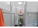 Well-lit hallway with neutral decor and a potted plant, creating a welcoming transition space at 5914 Mt Holly Huntersville Rd, Charlotte, NC 28216