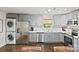 Spacious kitchen features stainless appliances, gray cabinetry, and ample counter space for cooking at 5914 Mt Holly Huntersville Rd, Charlotte, NC 28216