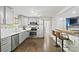 Modern kitchen boasts stainless steel appliances, gray cabinetry, and stylish backsplash tiling at 5914 Mt Holly Huntersville Rd, Charlotte, NC 28216