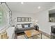 Inviting living room features a comfortable gray sofa, stylish decor, and a cozy atmosphere at 5914 Mt Holly Huntersville Rd, Charlotte, NC 28216