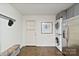 The mud room area boasts a stainless washer/dryer unit, cabinets, and outside access at 5914 Mt Holly Huntersville Rd, Charlotte, NC 28216