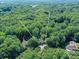 A beautiful aerial view of the surrounding lush green neighborhood and serene landscape at 5955 Mountain Point Ln, Charlotte, NC 28216