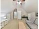 Bright bonus room featuring a piano, seating and a neutral color scheme at 5955 Mountain Point Ln, Charlotte, NC 28216