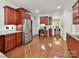 Spacious kitchen featuring stainless steel appliances, wood cabinets, and hardwood floors at 5955 Mountain Point Ln, Charlotte, NC 28216