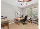 Home office with a vintage table desk, modern shelves and a bright window with natural light at 5955 Mountain Point Ln, Charlotte, NC 28216