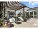 Outdoor patio featuring hanging egg chairs, lounge seating, and a view of the backyard at 606 Vega Nw St, Concord, NC 28027