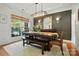 Stylish dining room with decorative lighting, large window, and a dining table with bench seating at 606 Vega Nw St, Concord, NC 28027