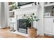 Close-up of a fireplace with decorative items, built-in shelves, and a hearth at 606 Vega Nw St, Concord, NC 28027