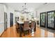 Well-lit kitchen featuring an island with seating, pendant lighting, and modern appliances at 606 Vega Nw St, Concord, NC 28027