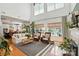 Spacious living room with high ceilings, large windows, and stylish decor creating a comfortable atmosphere at 606 Vega Nw St, Concord, NC 28027
