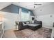 Bright living room with blue accent wall, ceiling fan and comfortable seating area at 606 Vega Nw St, Concord, NC 28027