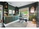 Charming office features built-in shelving, a window, neutral tones, and a desk area at 606 Vega Nw St, Concord, NC 28027