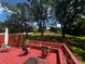 Spacious outdoor back deck with seating, surrounded by mature trees and lush greenery at 6109 Cora St, Charlotte, NC 28216