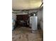 Unfinished basement with water heater and storage at 6109 Cora St, Charlotte, NC 28216
