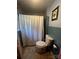 Cozy bathroom featuring a toilet, shower with curtain, and tiled walls at 6109 Cora St, Charlotte, NC 28216